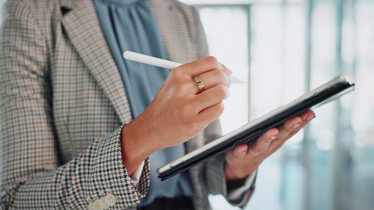 Woman using tablet with stylus
