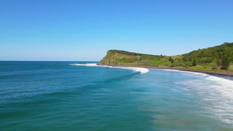 pat morton lookout at the cliff of lennox headland at the shoreline of seven mile beach in australia, aerial