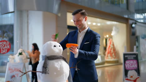 man building a snowman