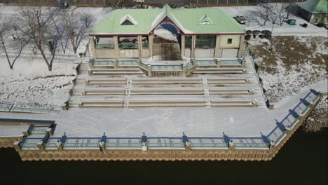 drone flyaway footage of mcgregor park in the snow, on the cumberland river in clarksville tennessee