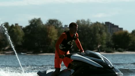 man riding jet ski in slow motion. male rider on jet ski. sportsman on jet ski