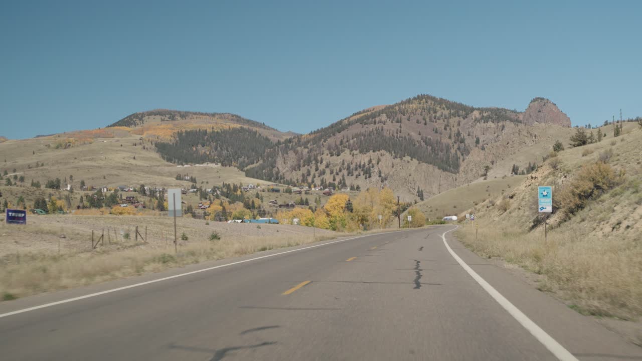 Road through mountainous landscape in autumn