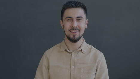 smiling man with an ok gesture