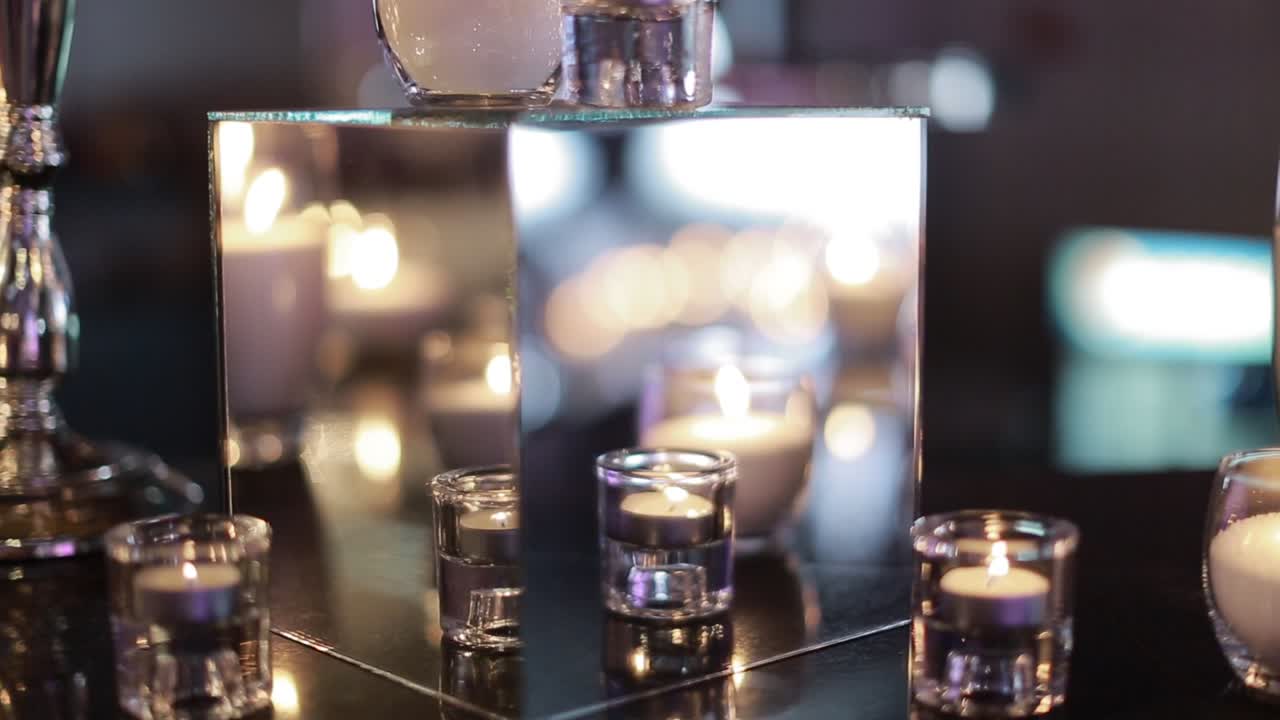 Decorative candles burning on a banquet table