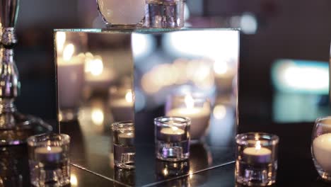 decorative candles burning on a banquet table