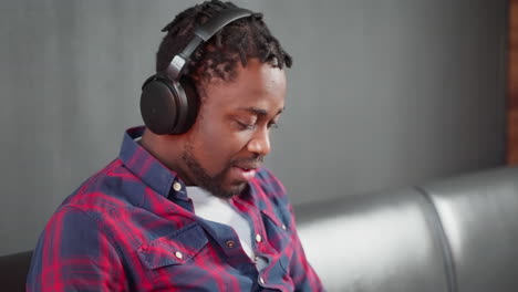 man listening to music on headphones
