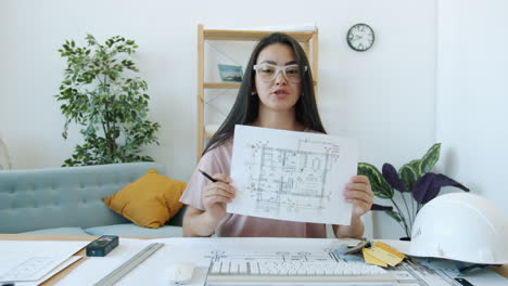 woman architect reviewing house plans