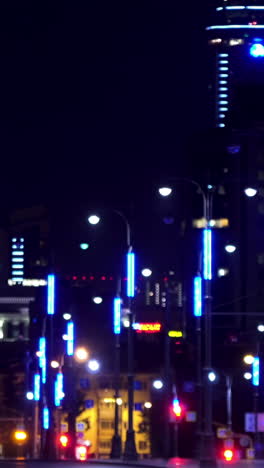 blurred night cityscape with blue lights