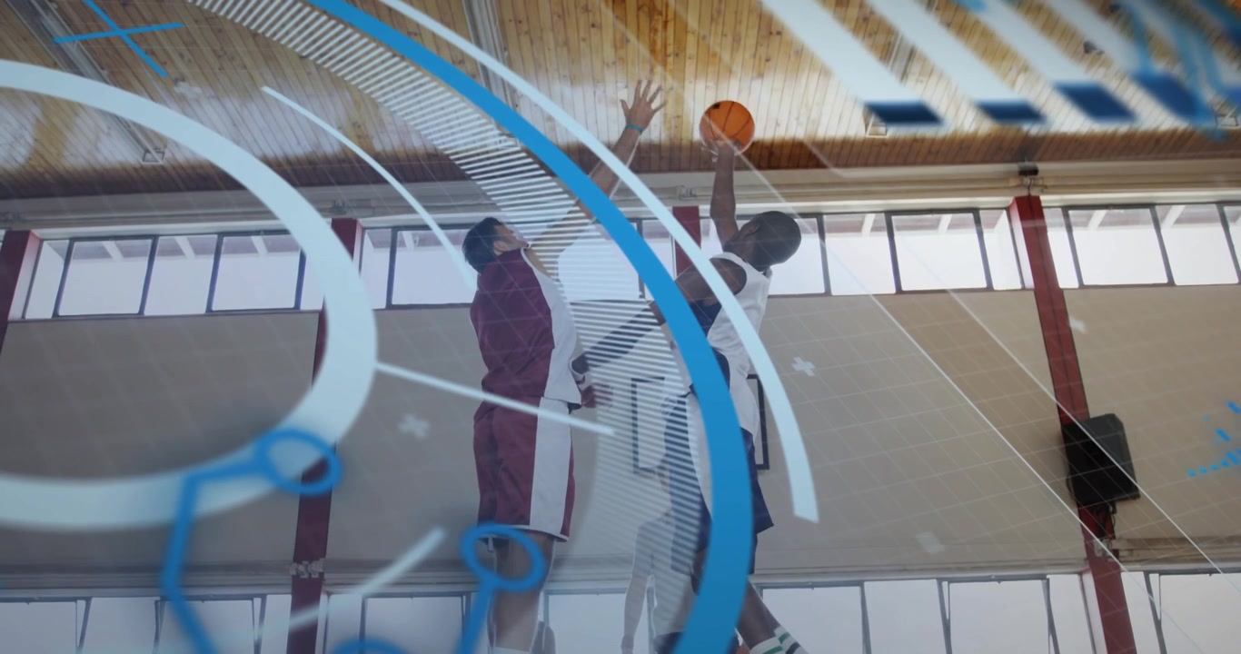Referee tossing ball overhead for tip-off as two rivals jumping with digital sports stats on court