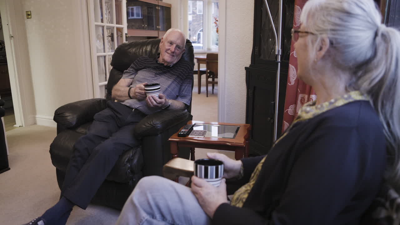 Elderly couple relaxing at home
