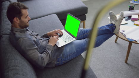 Male-executive-working-on-laptop-in-a-modern-office-4k