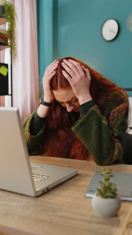 displeased sad office woman using laptop working loses bad news computer virus fail loss game