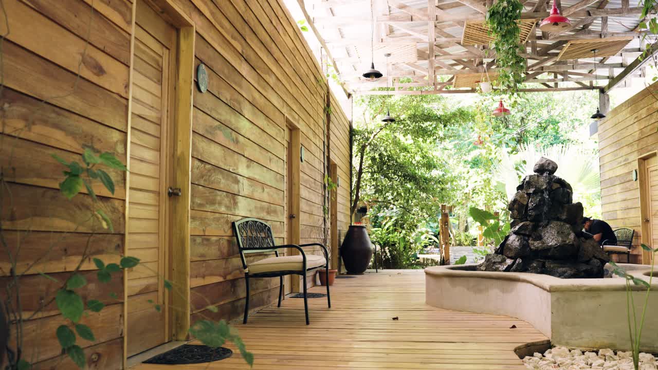 Outdoor Oasis with Wooden Deck and Water Feature