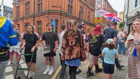 crowd gathers for a festive street event