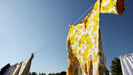 yellow floral dress drying in the sun