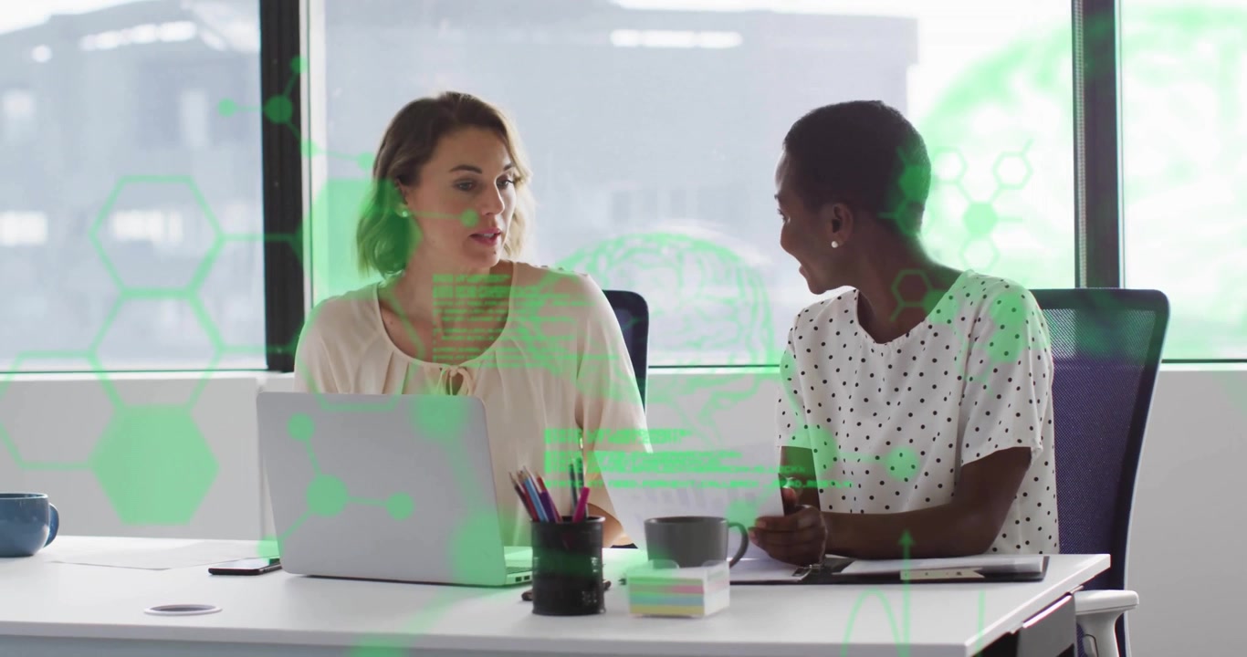 hexagonal scrolling code overlay appearing, two women reviewing data at desk by pointing and typing