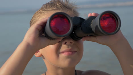 little explorer with binoculars