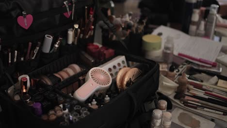 open makeup kit with brushes and beauty products prepared for bridal wedding session