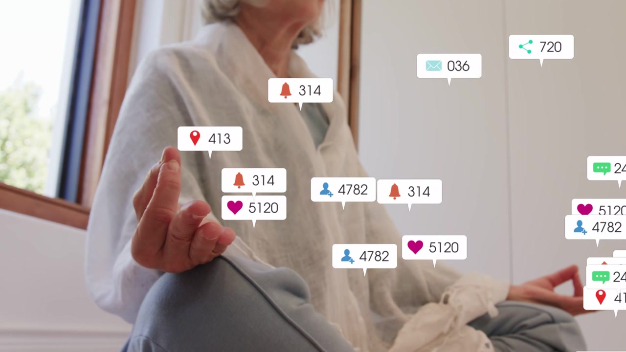 Senior woman meditating on cushion by window, incoming notifs appearing, clustering, dispersing