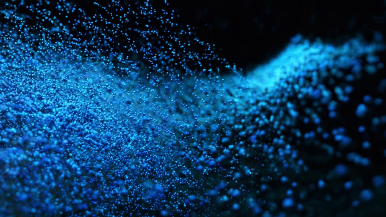 Mesmerizing Blue Water Droplets Create a Stunning Visual Display of Texture and Depth, Capturing the Beauty of Fluid Dynamics in a Dark Environment