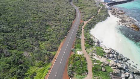 Cape-Leeuwin-coastline-in-Australia-with-empty-road-near-Indian-Ocean