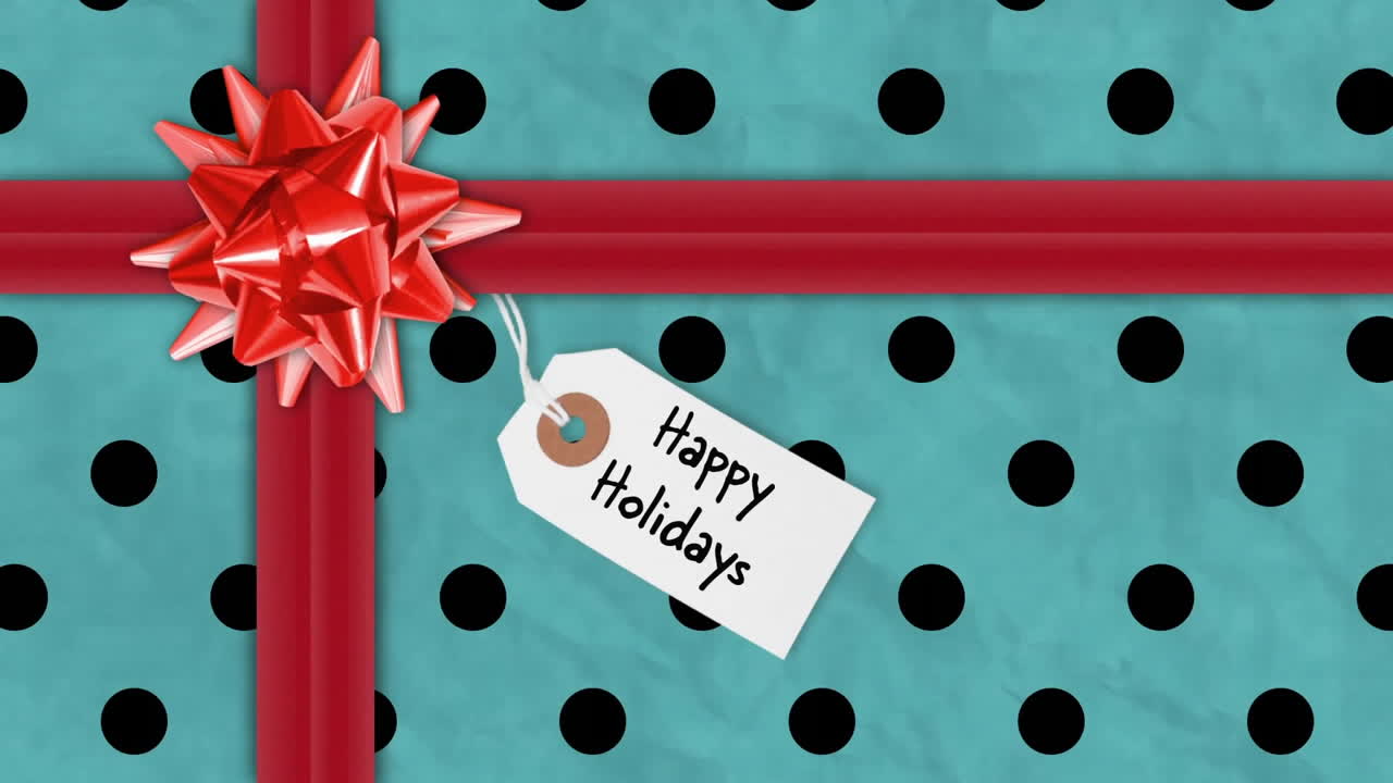 Animation of happy holidays text on tag over christmas present with red ribbon