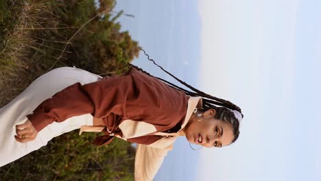 Stylish-woman-dancing-in-countryside