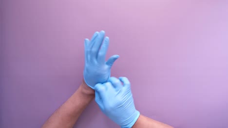 putting on medical gloves