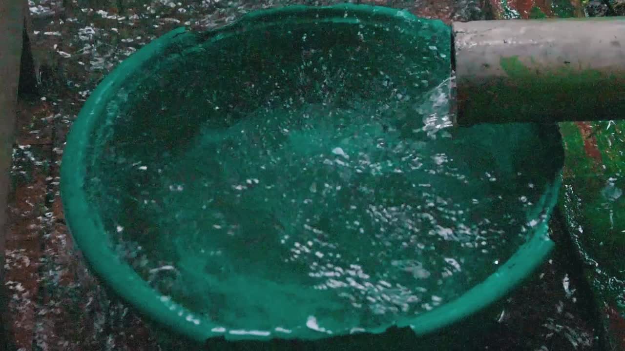 Pouring water in down spout