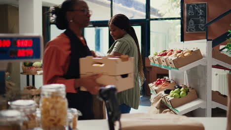african american client pouring various bulk products from jars