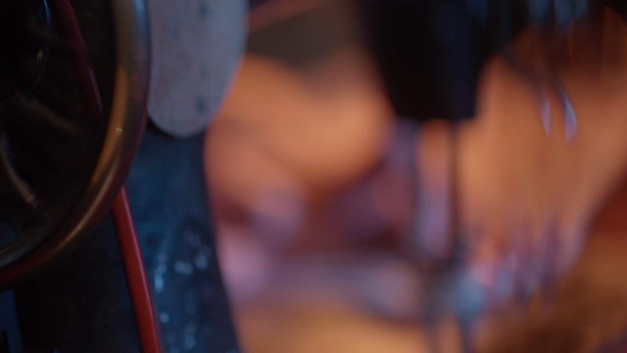 Close-up of Hands Operating a Vintage Sewing Machine