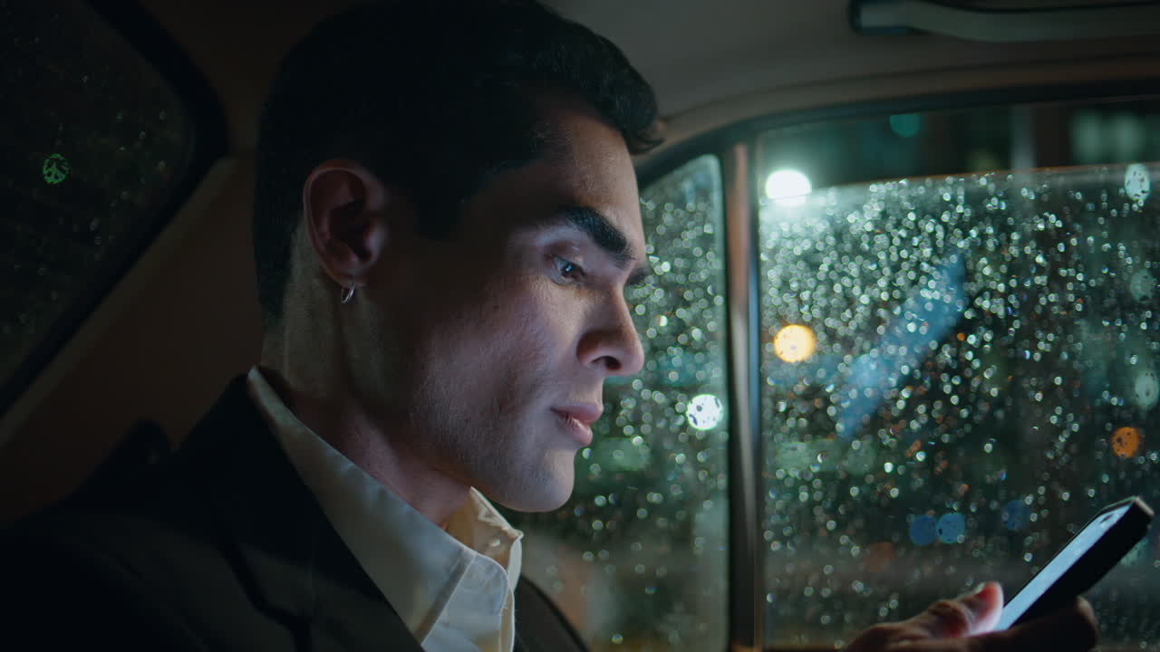 Serious director dictating phone message car closeup. Man using voice assistant