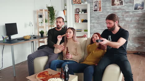 group of close friends enjoying their beer and pizza