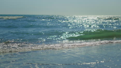 ocean waves on a sunny beach