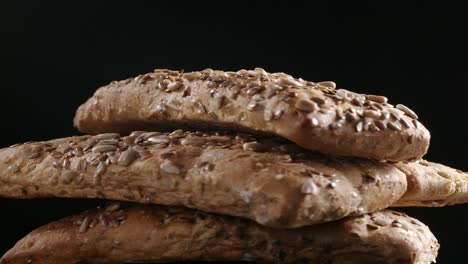 shooting of rotating bread with flax and sunflower seeds