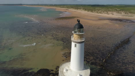 Aerial-footage-of-Rattray-Head-lighthouse,-Buchan,-Aberdeenshire,-Scotland