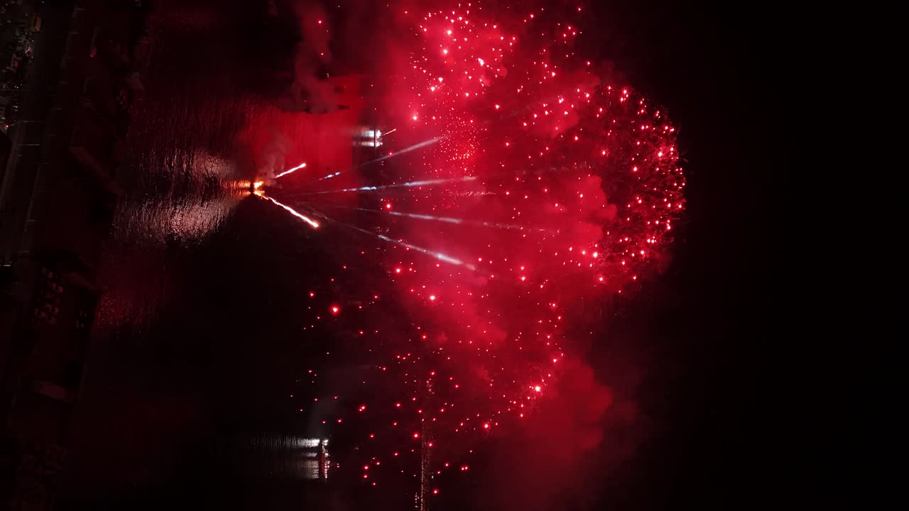 Aerial vertical view of the New Year's Eve fireworks event from the boats off the coast of Valparaiso Chile at night