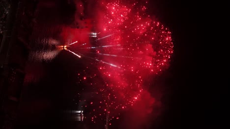 Aerial vertical view of the New Year&#039;s Eve fireworks event from the boats off the coast of Valparaiso Chile at night