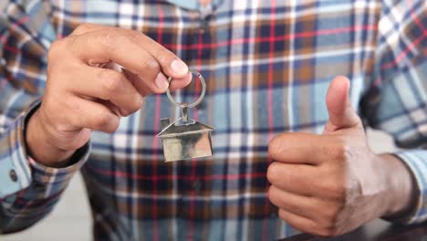 person holding house keys