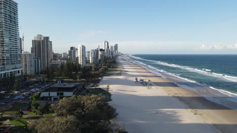 gold coast australia modern beach city beachfront buildings, aerial ocean waves