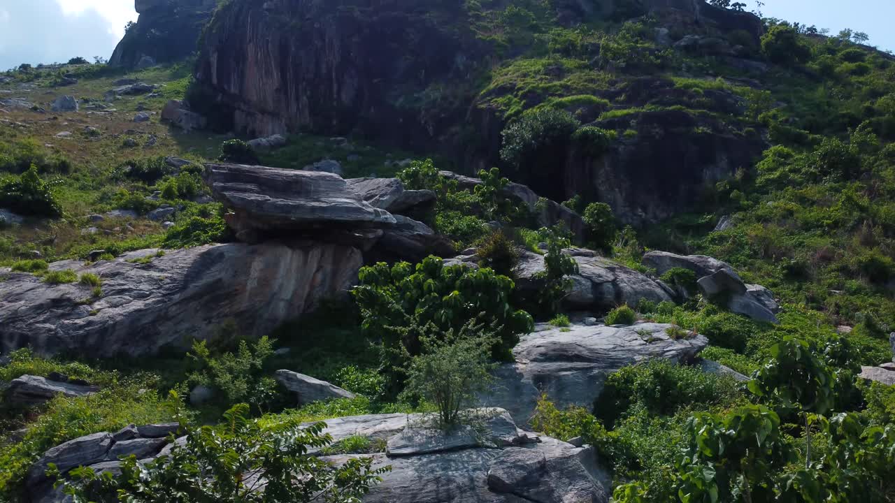 Rock formations in layered landscape with green surroundings in rural outskirts of Abuja, Nigeria