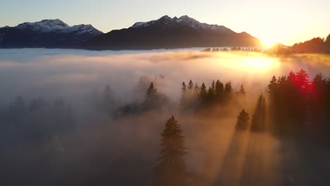 dense clouds over mountain valley at sunset