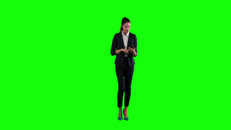 Animation-of-a-Caucasian-woman-in-suit-walking-and-using-a-phone-in-a-green-background