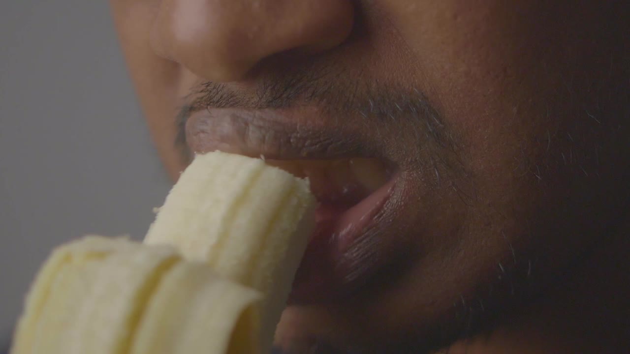 Man eating a banana