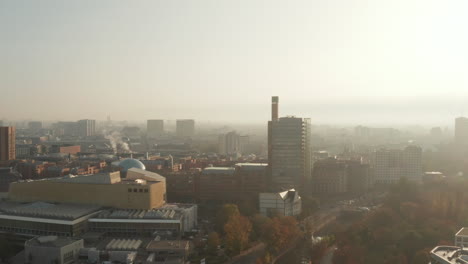 Aerial-panoramic-view-of-modern-building-in-Potsdamer-Platz-area-against-bright-morning-sun.-Rush-hour-on-roads.-Berlin,-Germany