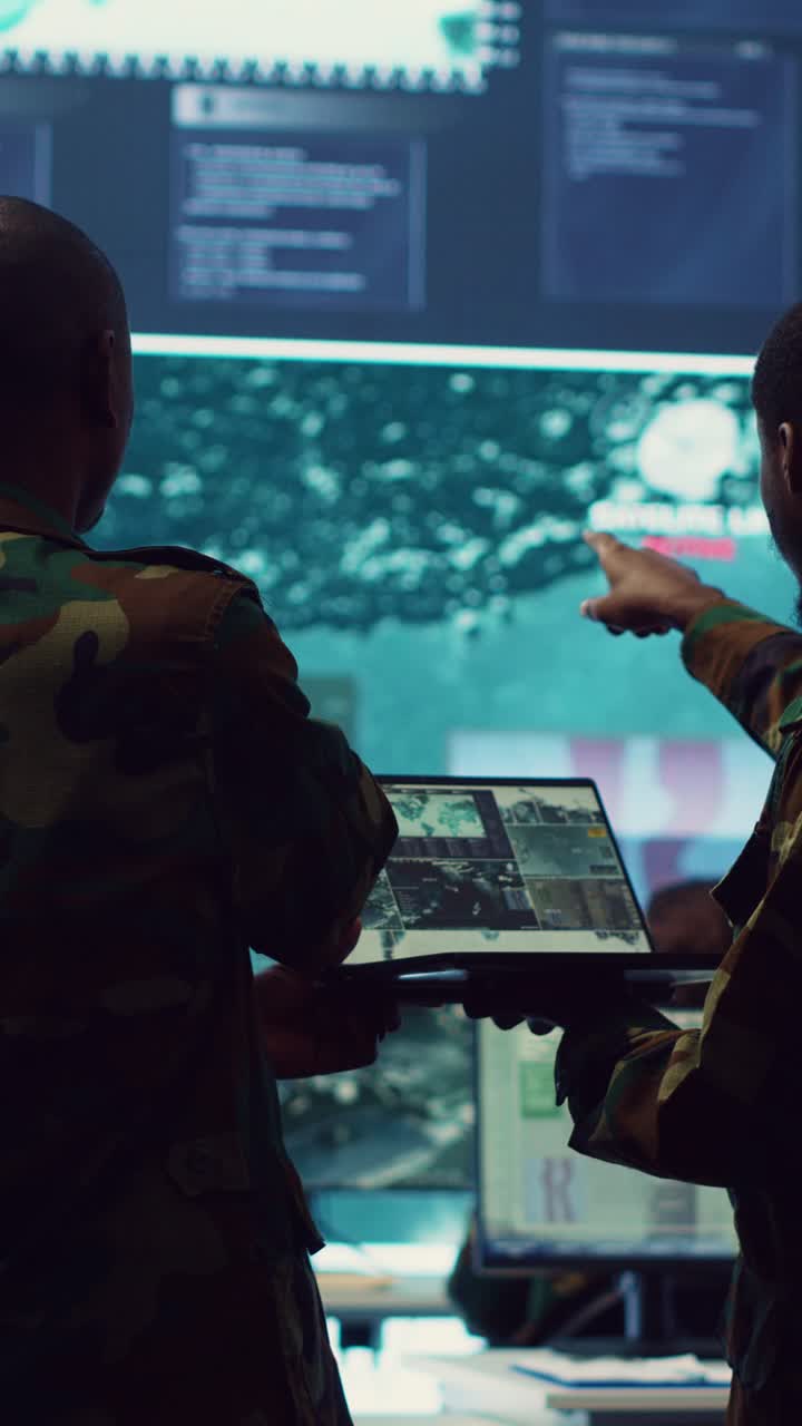 Military Soldiers Analyzing Surveillance Data in Command Center