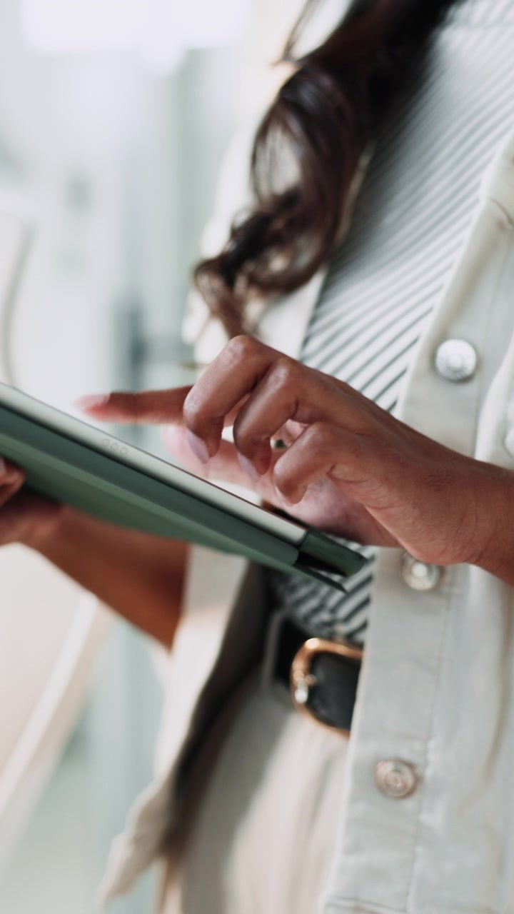 Woman Using a Tablet Computer in a Professional Setting