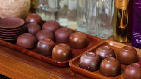 assorted chocolates and tea cups on display