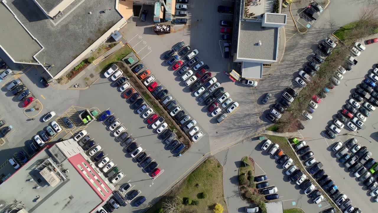 Overhead View Of Cars Parked In The Parking Lots Of Mission Memorial Hospital In BC, Canada. - aerial shot