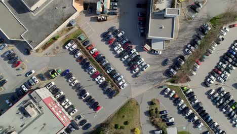 overhead view of cars parked in the parking lots of mission memorial hospital in bc, canada. - aerial shot